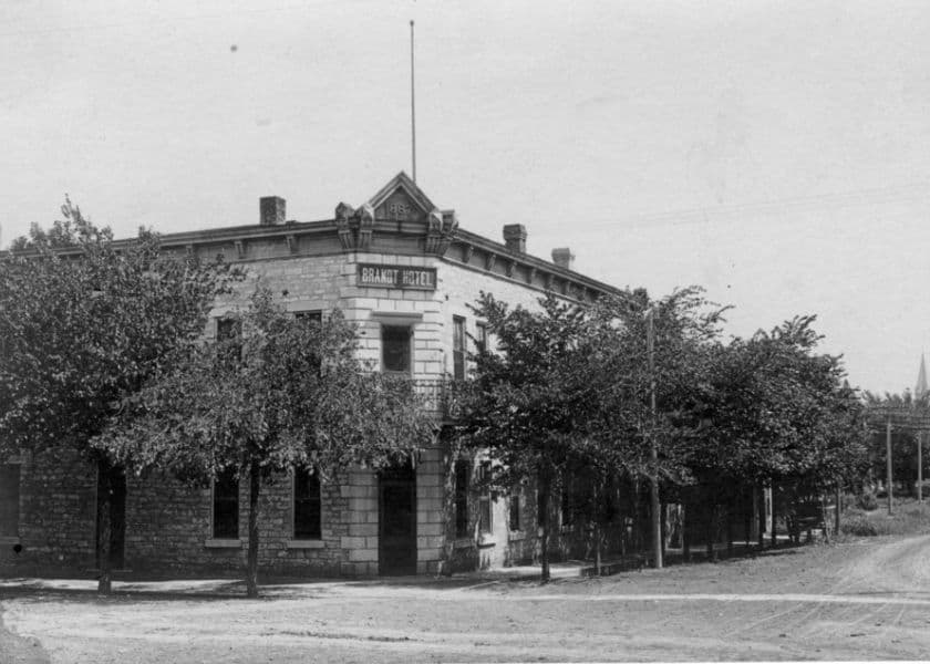 Historic photo of the Grant Hotel surrounded by trees.