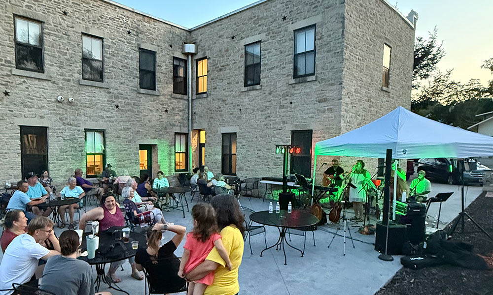 Guests enjoying patio at night