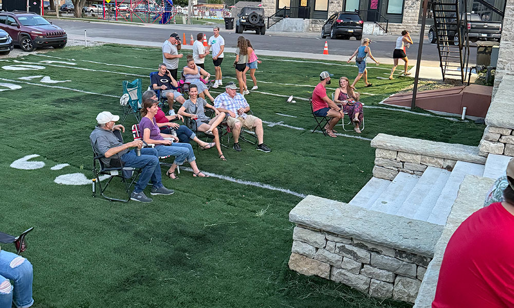 guests enjoying lawn near patio