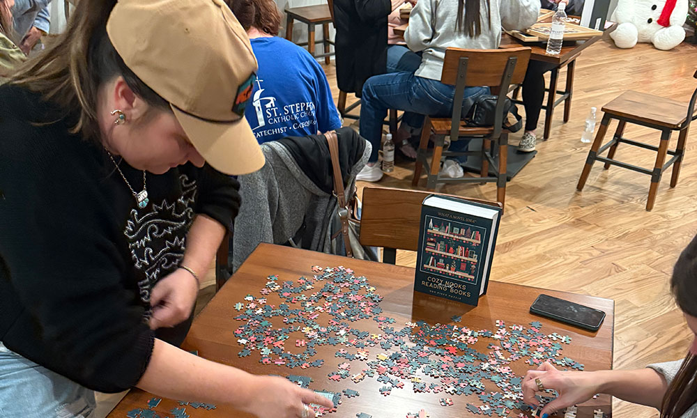 people putting puzzle together