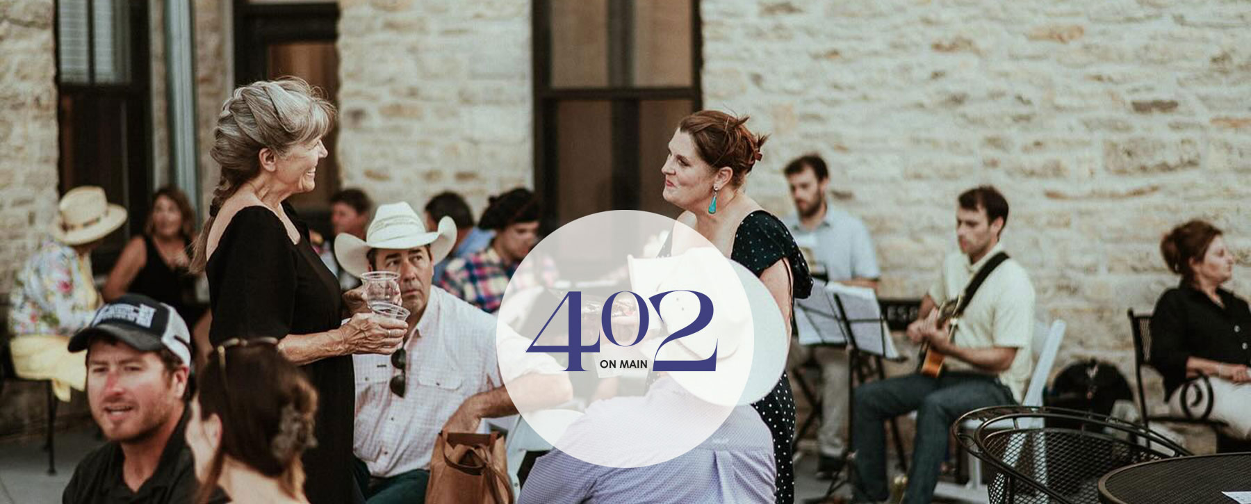 two ladies talking outside on venue patio